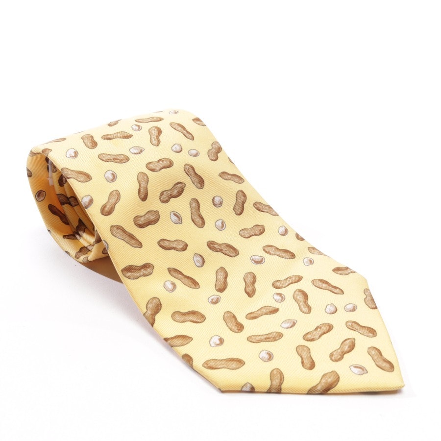 ties from Hermès in yellow and brown